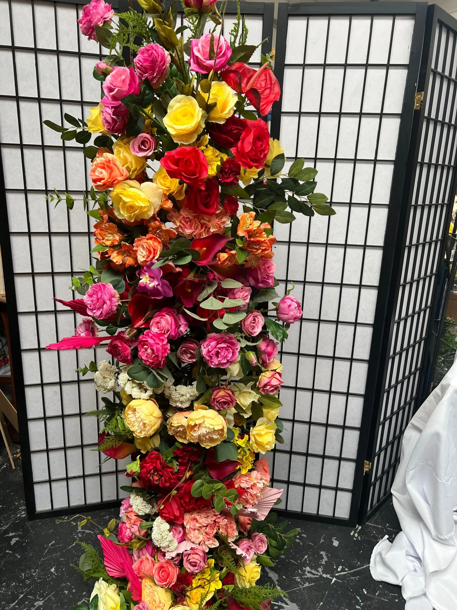 IVY CRUZ Flower Walls, Floral Arrangements | Commercial and Functions Vibrant Red and Yellow Flower Garland