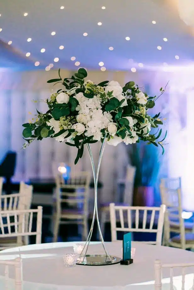 IVY CRUZ Flower Walls, Floral Arrangements | Commercial and Functions White Roses Green Foliage Wedding Table Centrepiece - Image 4