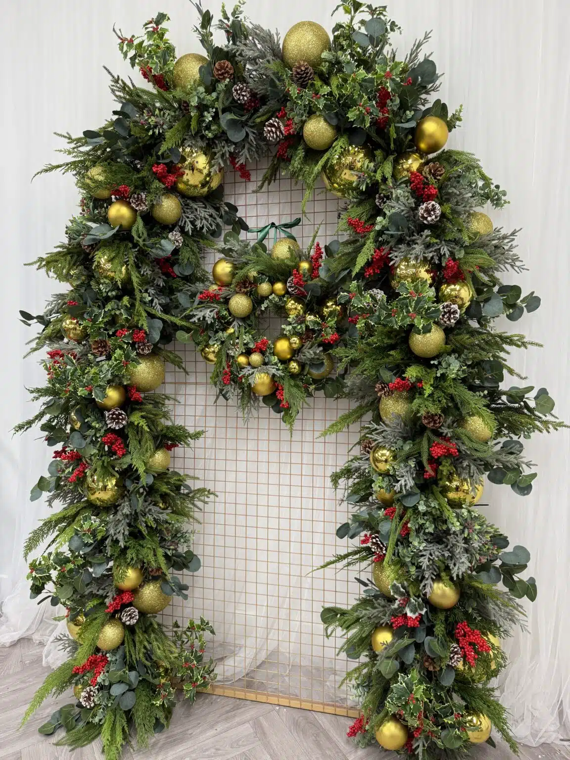 IVY CRUZ Flower Walls, Floral Arrangements | Commercial and Functions Traditional Gold & Red Christmas Doorway Garland - Restaurant Doorway Decor